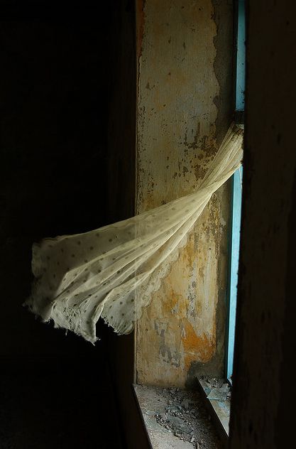 antique lace curtain blowing
