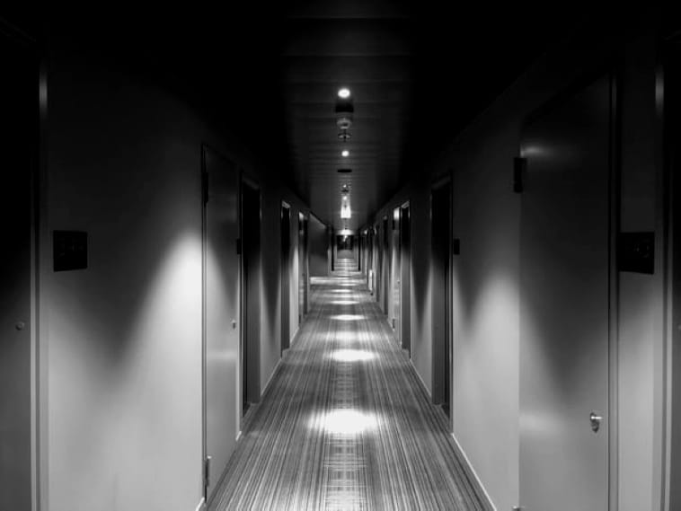 a poem by Tricia McCallum. April 10,. 2020. A long apartment hallway, dimly lit.