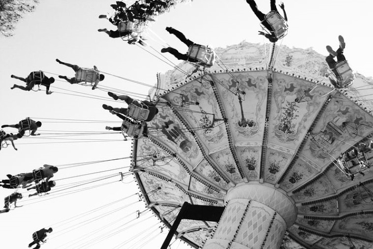 A poem by Tricia McCallum March 27 2020. A spinning carousel at a midway.