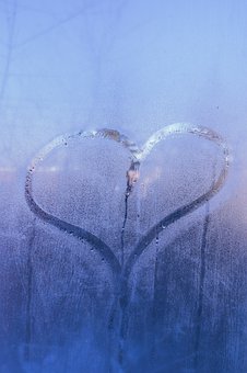 heart traced on window