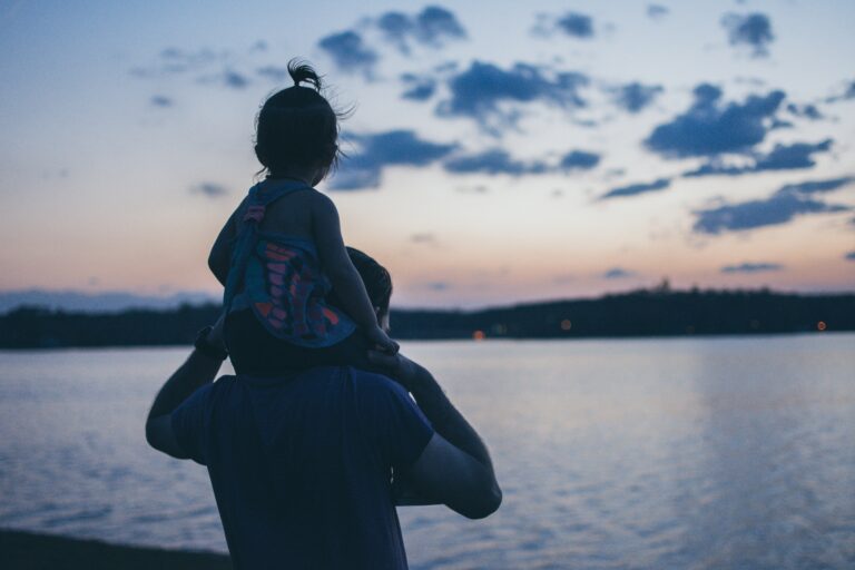 man carries girl